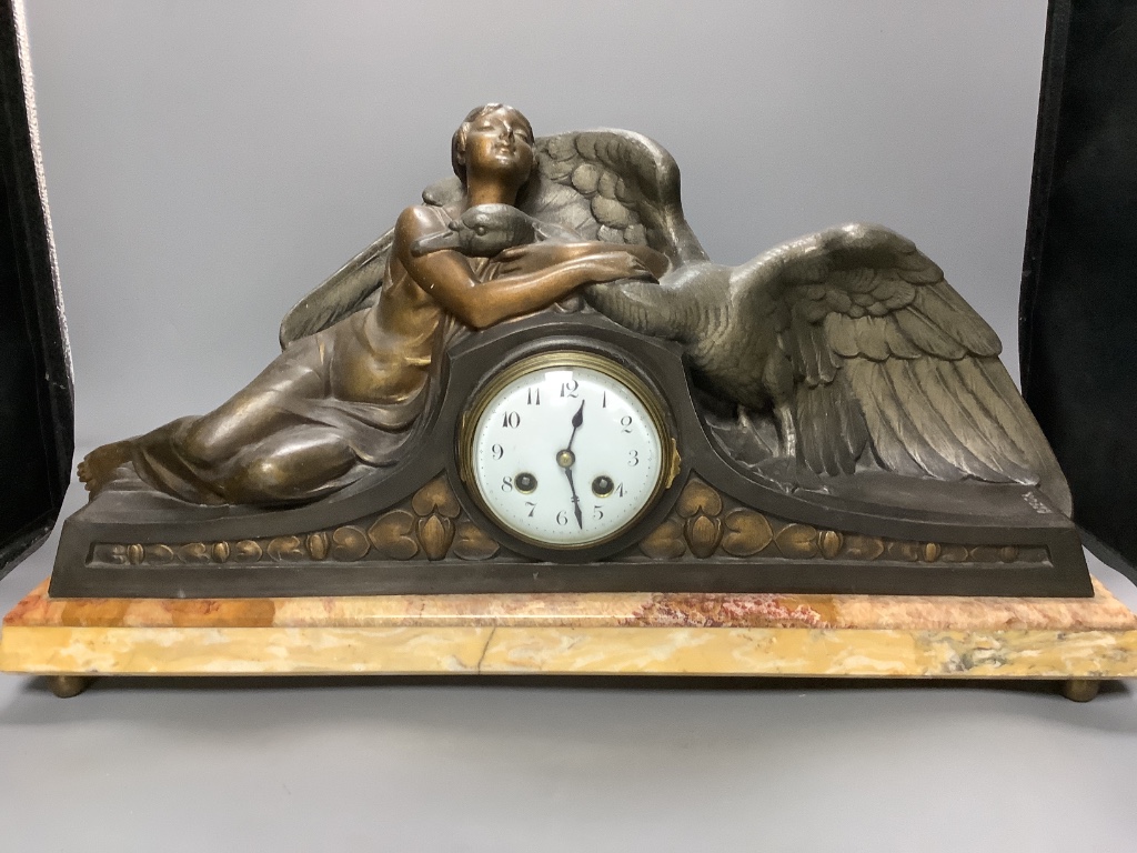 A large Art Deco patinated spelter and marble figural clock garniture, signed P. Seca, longest piece 58cm